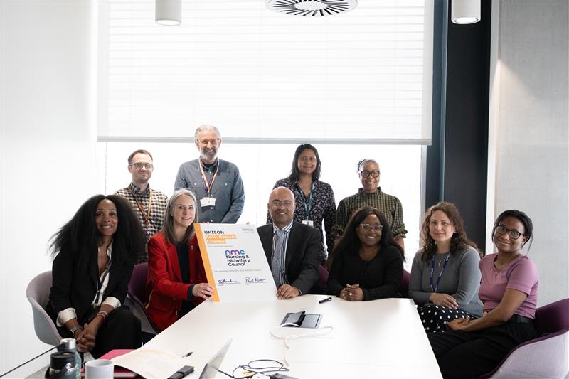 NMC Interim Chief Executive and Registrar, Paul Rees, the Culture Transformation Steering Group and UNISON pictured with the signed Anti-Racism Charter